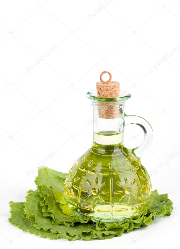 Cruet with oil on lettuce