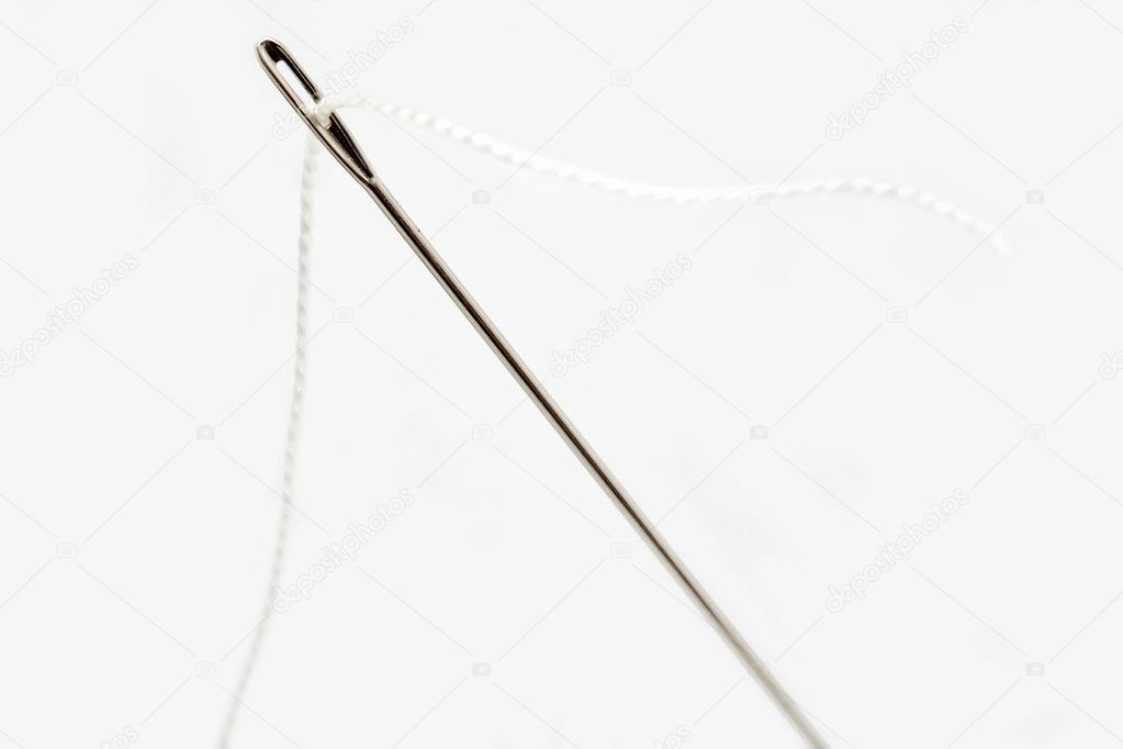 Needle with white thread