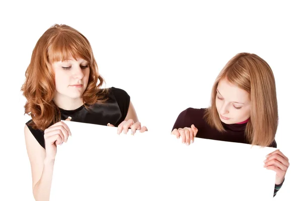 Two girls with white paper in hands — Stock Fotó