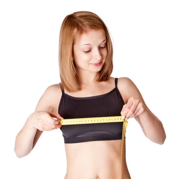 Young girl measures a breast — Stock Photo, Image