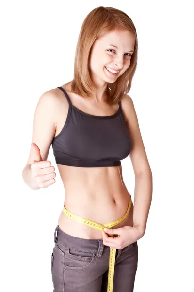 Young girl measures a waist — Stock Photo, Image