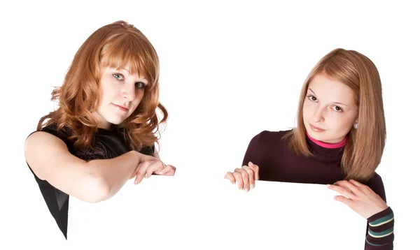 Two girls with white paper in hands — Stock Photo, Image