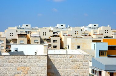 Flat roofs of new yellow apartment build clipart