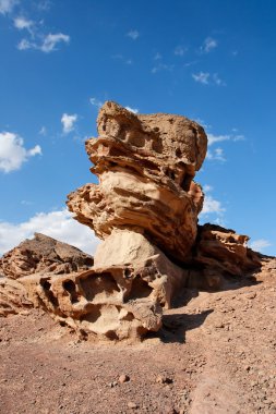 Scenic orange rock in shape of mushroom clipart