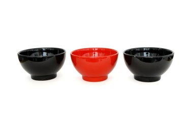 Row of 2 black and 1red porcelain bowls clipart