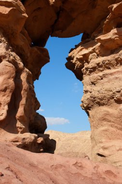 Window in the orange sandstone rock clipart