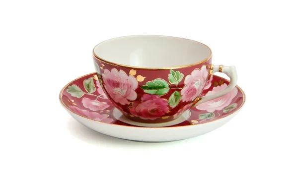 Čaj šálek a talířek s květinovým vzorem — Stock fotografie