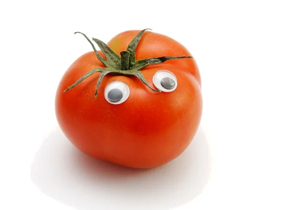 Funny red tomato with eyes on white back — Stock Photo, Image