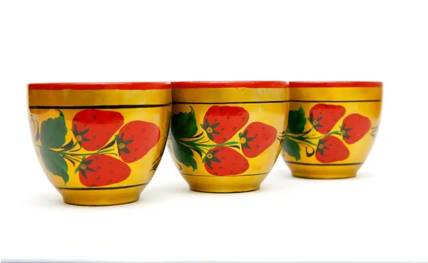 Three painted Russian wooden cups — стокове фото