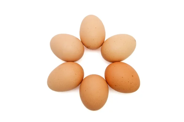 Шестикутна зірка з шести коричневих яєць — стокове фото