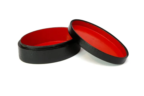 Овальна лакована червоно-чорна коробка — стокове фото