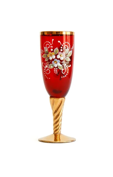 Vacker rött vin glas med guld stam — Stockfoto