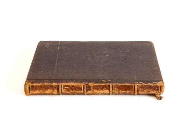 Antique book lies isolated