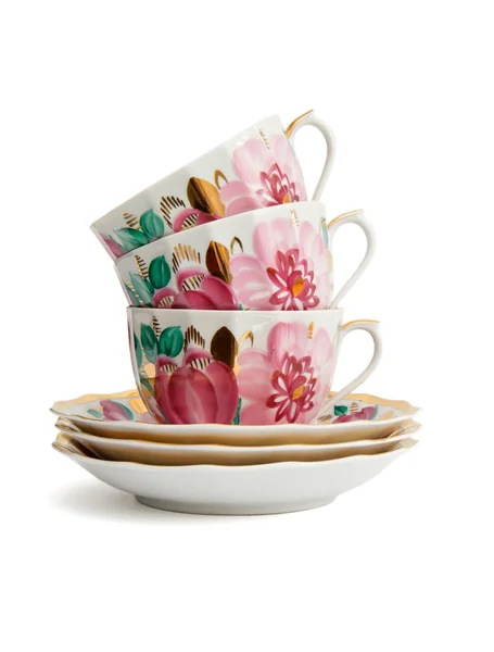 Stack di tazze da tè in porcellana con piattini — Foto Stock