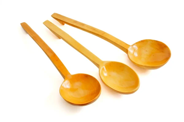 Tre cucchiai di legno su sfondo bianco — Foto Stock