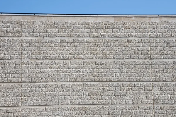Vertical wall of gray stone blocks — Stock Photo, Image