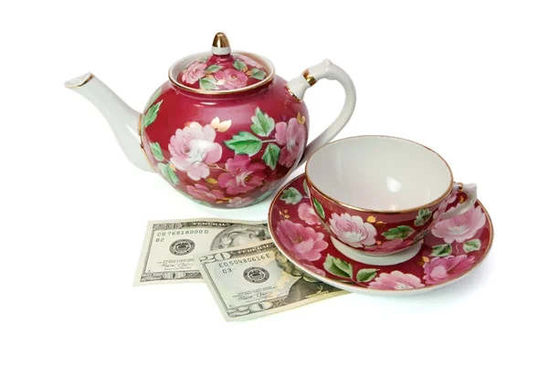 Tea service stands on dollar banknotes — Stock Photo, Image