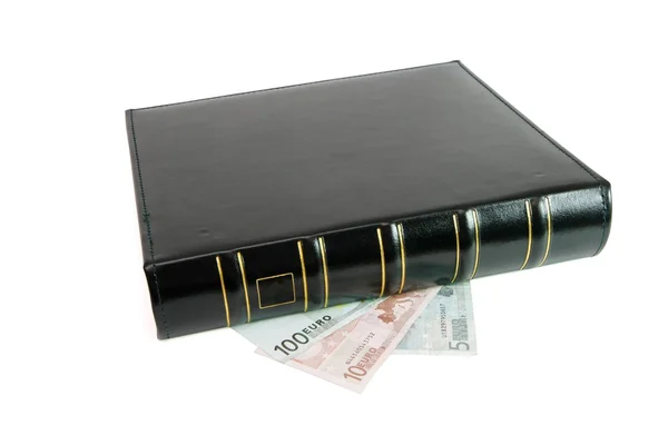 Thick black book and euro bills — Stock Photo, Image