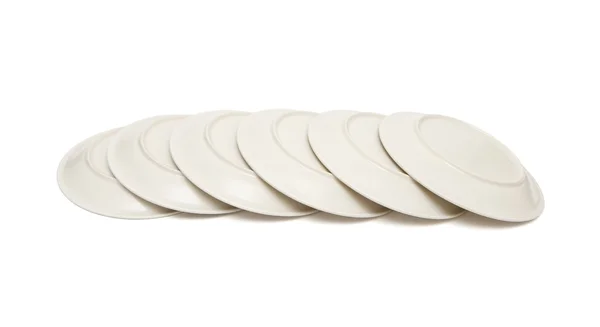 Stack of plain beige plates tiled — Stock Photo, Image