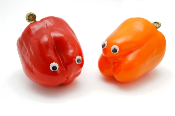 Two sweet bell peppers with eyes — Stock Photo, Image