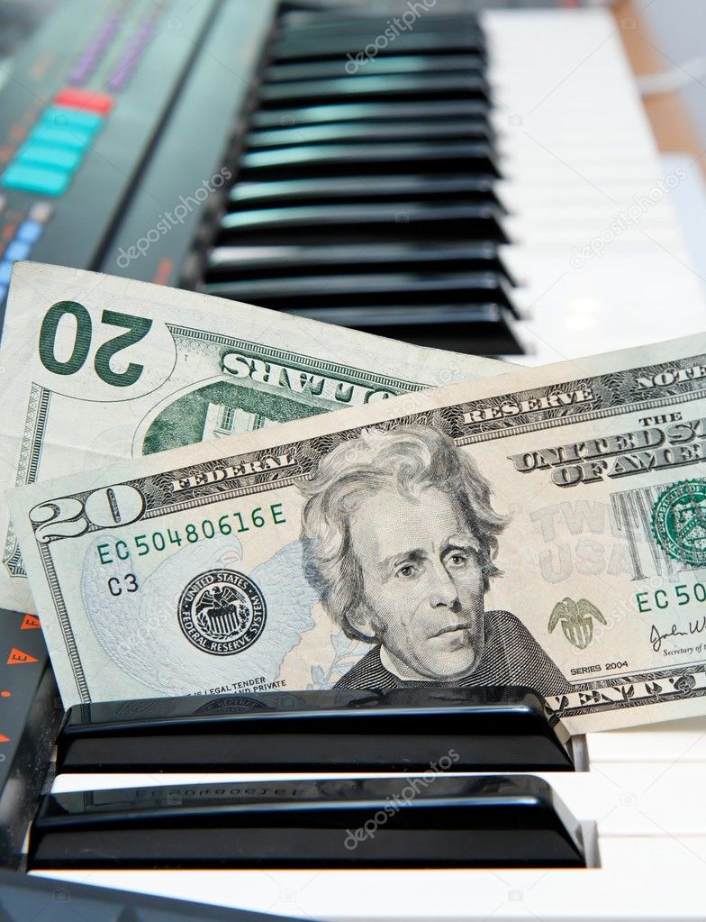 Dollar bills in electric organ keyboard