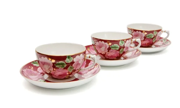 Tre tazze da tè con piattini — Foto Stock