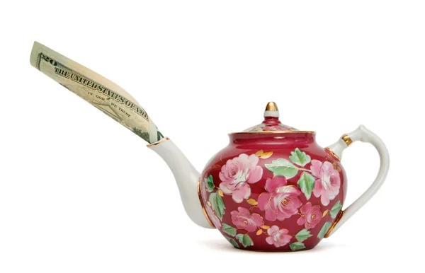 Blumenbemalte Teekanne mit Dollarschein — Stockfoto