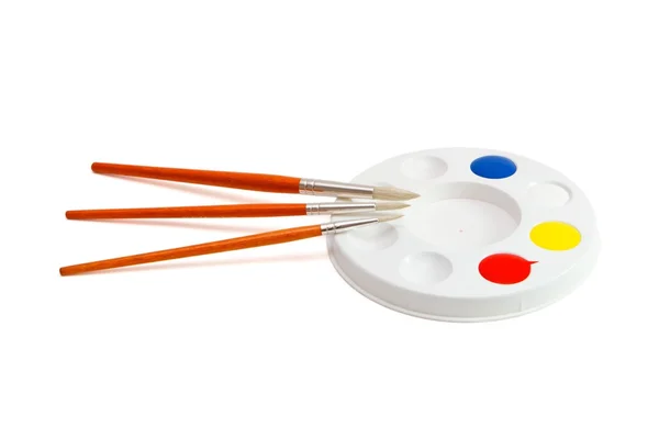 Round kids palette with paintbrushes — Stock Photo, Image
