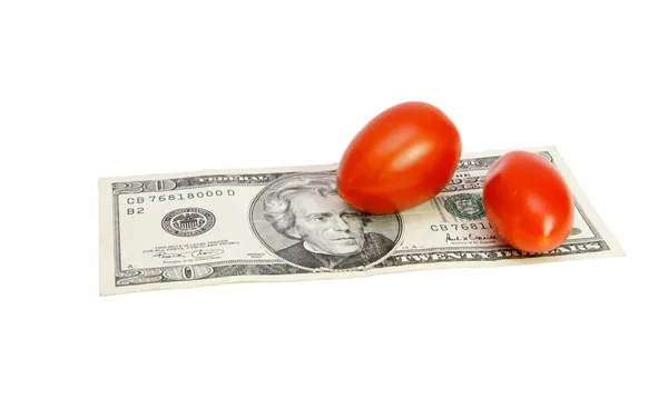 Small tomatoes on twenty dollar bill — Stock Photo, Image