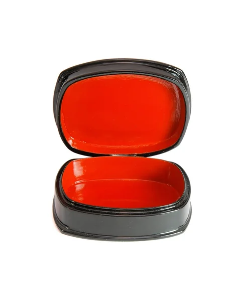 Open ovale zwarte kistje met rode voering — Stockfoto