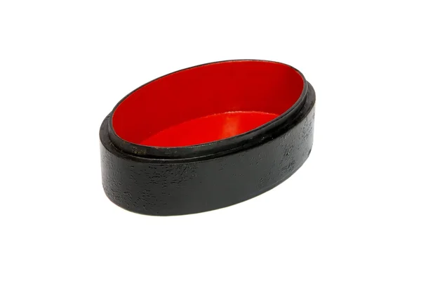 Ataúd ovalado vacío rojo y negro — Foto de Stock