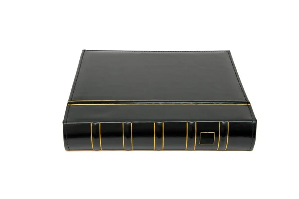 Dikke zwarte boek met gouden trimmen — Stockfoto
