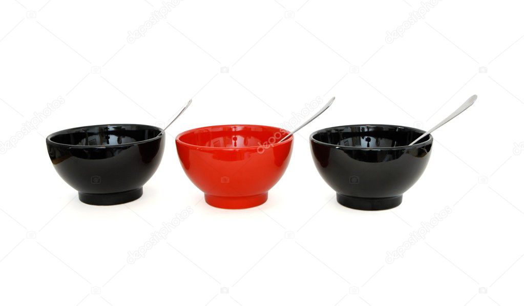 Row of porcelain bowls with spoons