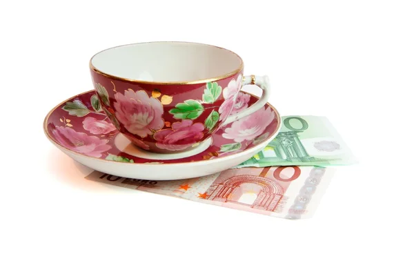Tea service stands on euro banknotes — Stock Photo, Image