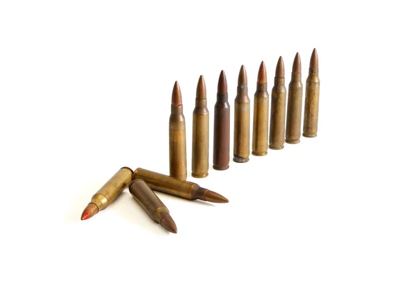 Standing and fallen M16 cartridges — Stock Photo, Image