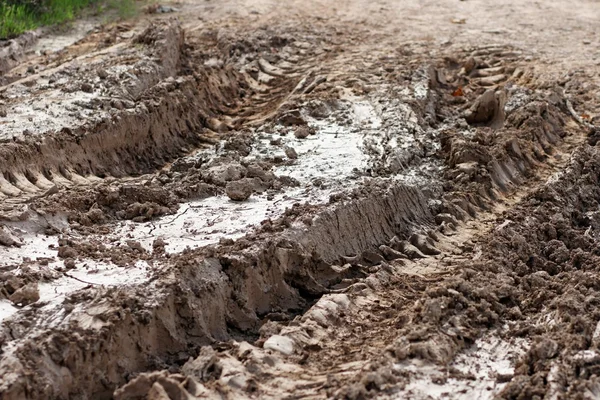 stock image Closeup of car ruts in dry road mud