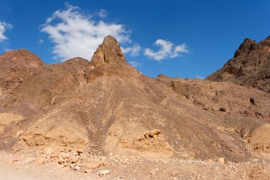 Scenic triangular rocks in stone desert clipart