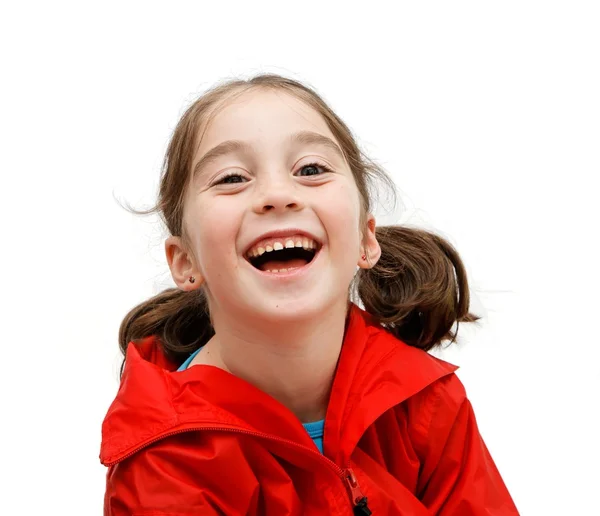 Zeven jaar meisje met pigtails lachen — Stockfoto