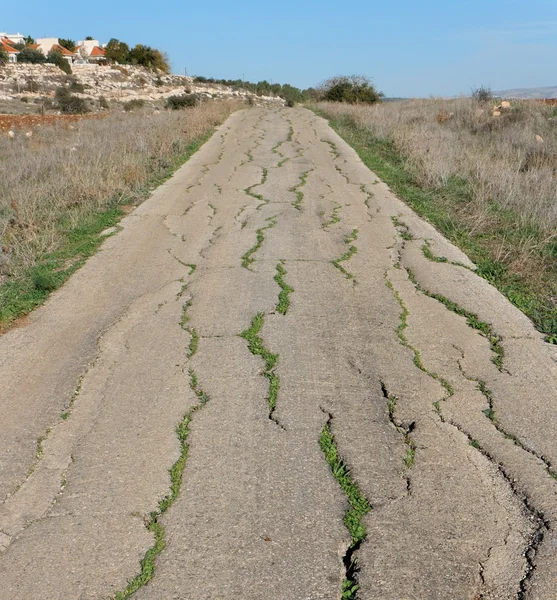 Old cracked countryside road — Stock Photo, Image