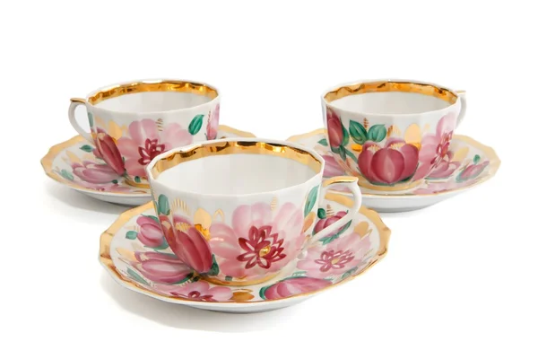 Tre tazze da tè con piattini — Foto Stock
