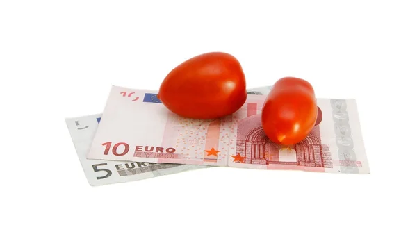 Pequeños tomates en billetes en euros — Foto de Stock