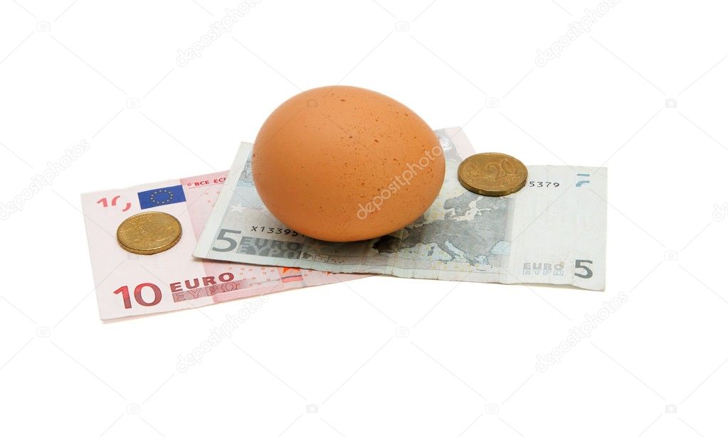 Brown egg on small euro money