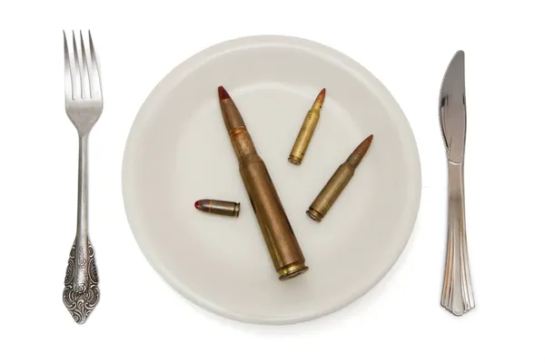 Various cartridges on the plate — Stock Photo, Image