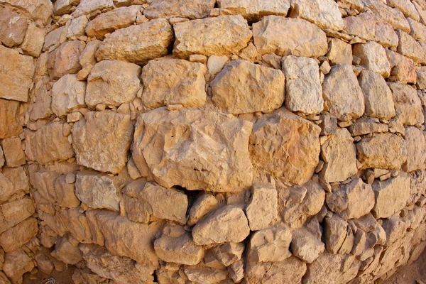 Wypukłe starożytny kamienny mur tekstura — Zdjęcie stockowe