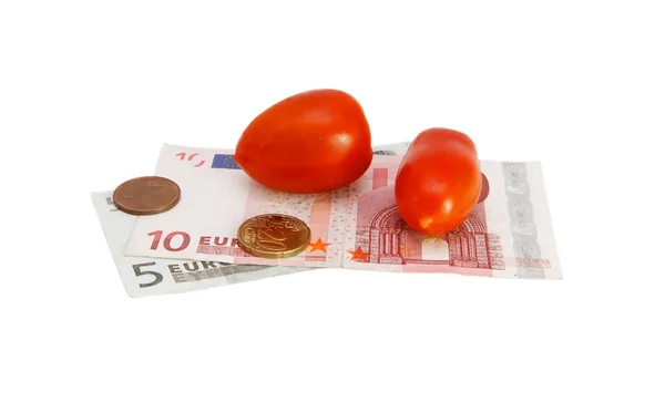Kleine tomaten op euro geld — Stockfoto