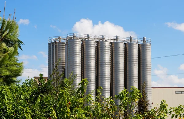 Twelve tower silos on chemical plant — Stock Photo, Image