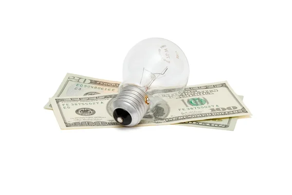 Ampoule électrique sur billets de dollar isolé — Photo