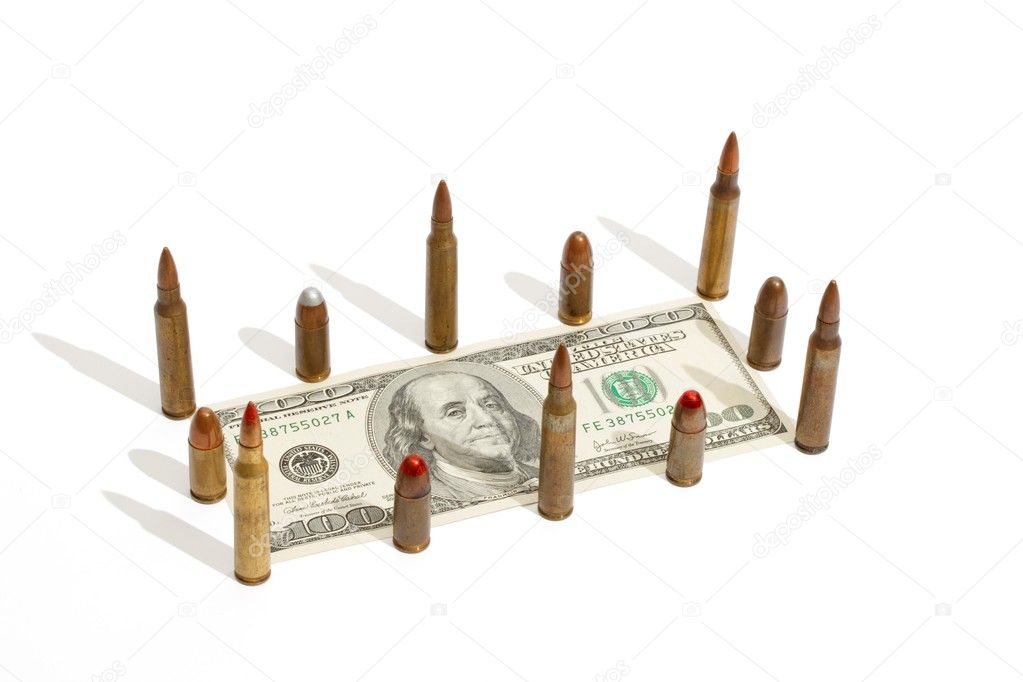 Hundred dollar bill fenced by cartridges