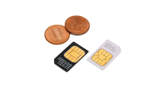 SIM-карты для мобильных телефонов и центов — стоковое фото