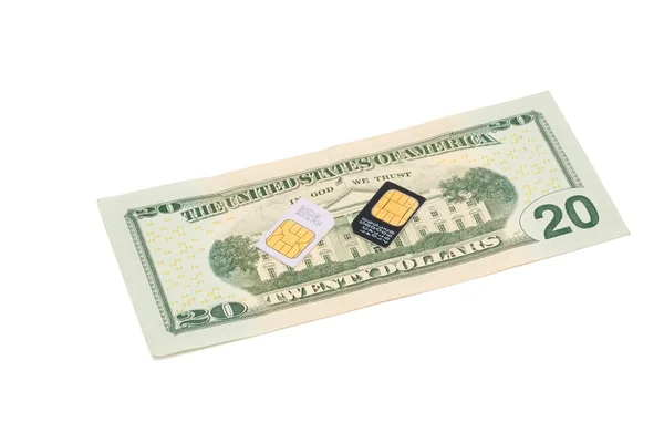 SIM cards for cell phones on dollar bil — Stock Photo, Image
